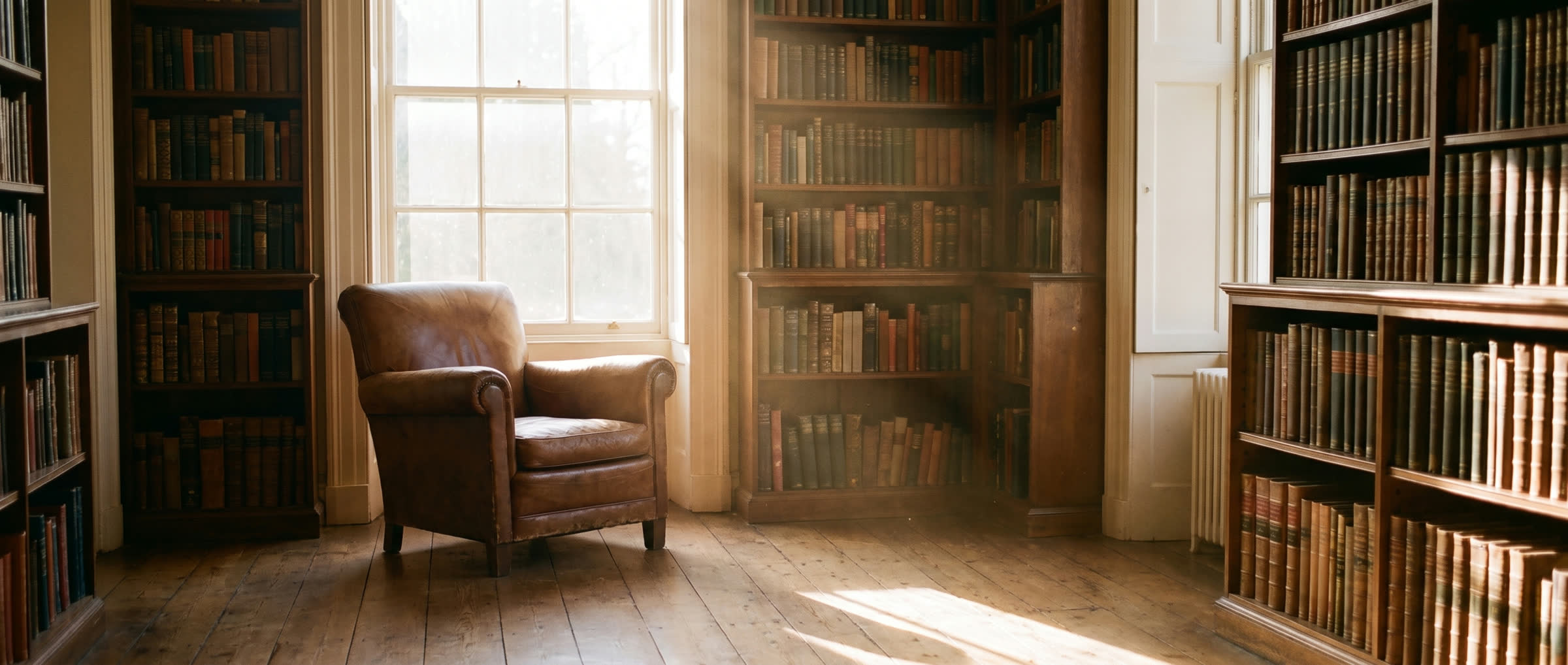A quiet study lined with books in morning light — the reading and research the protocols come from